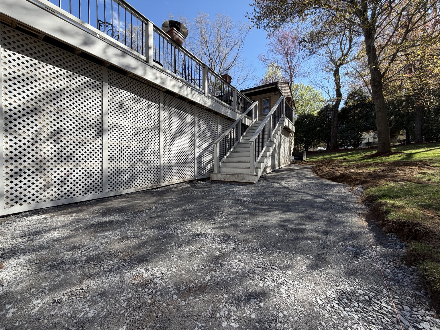 Processed-gravel base installed and compacted during Bellingham Massachusetts patio project