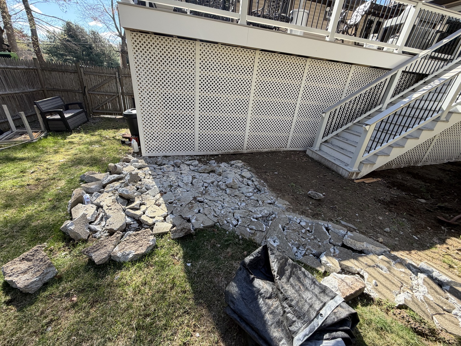 Excavated patio area prepared for the new base during Bellingham Massachusetts patio project