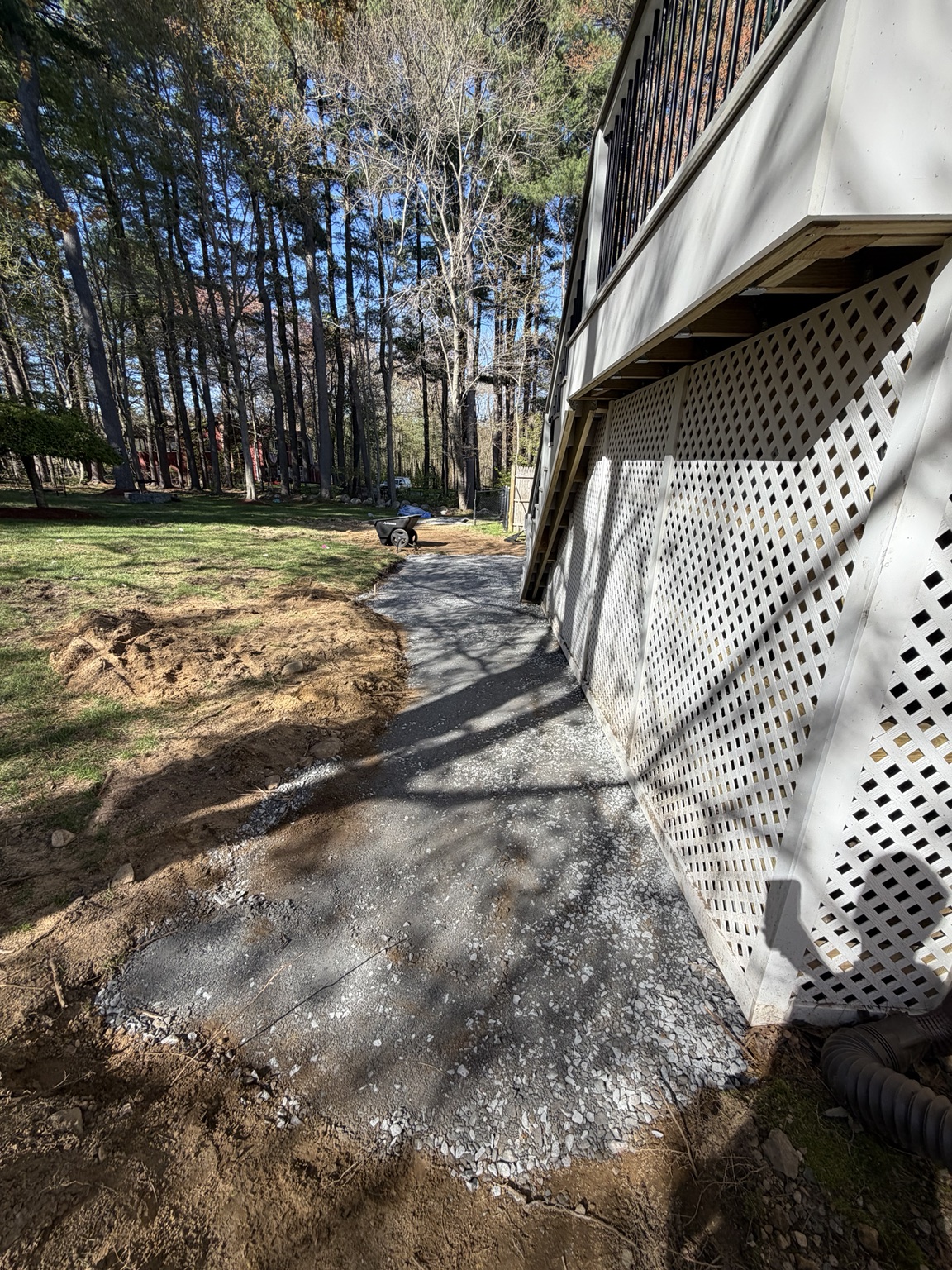 Base preparation extended along the connecting walkway during Bellingham Massachusetts patio project